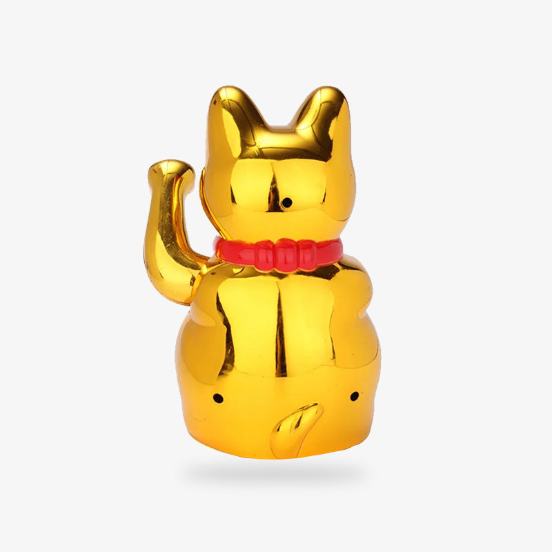 The gold maneki neko is a Japanese cat statuette that can be placed on a shelf or desk. It is a talisman in the shape of a cat that attracts wealth.