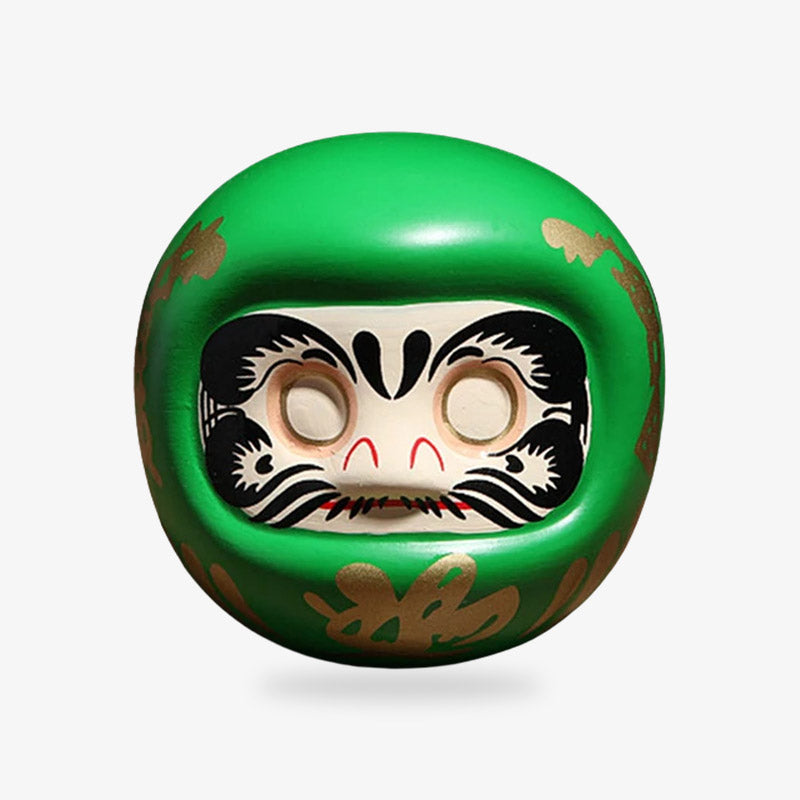 Green Daruma doll representing health and wellness, a Japanese symbol for physical well-being and recovery