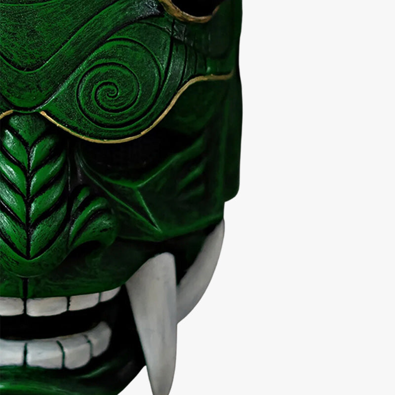 Discover the green Oni mask meaning, a handcrafted piece symbolizing Japanese folklore, made from high-quality materials, painted by hand, with horns and sharp teeth