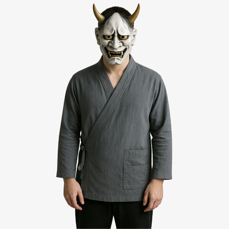 Grey traditional Japanese samue with understated tones and timeless design, ideal for calm and reflective wear. The man is wearing a white japanese hannya mask on his face