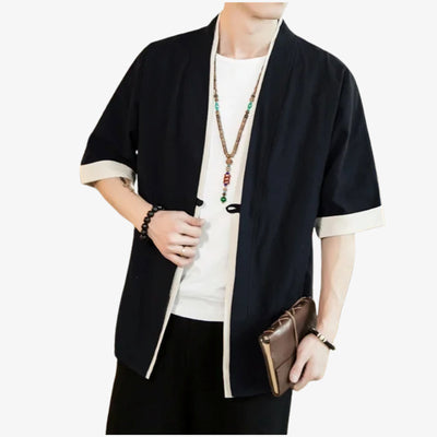 Person wearing a haori clothing black with white trim on a white background