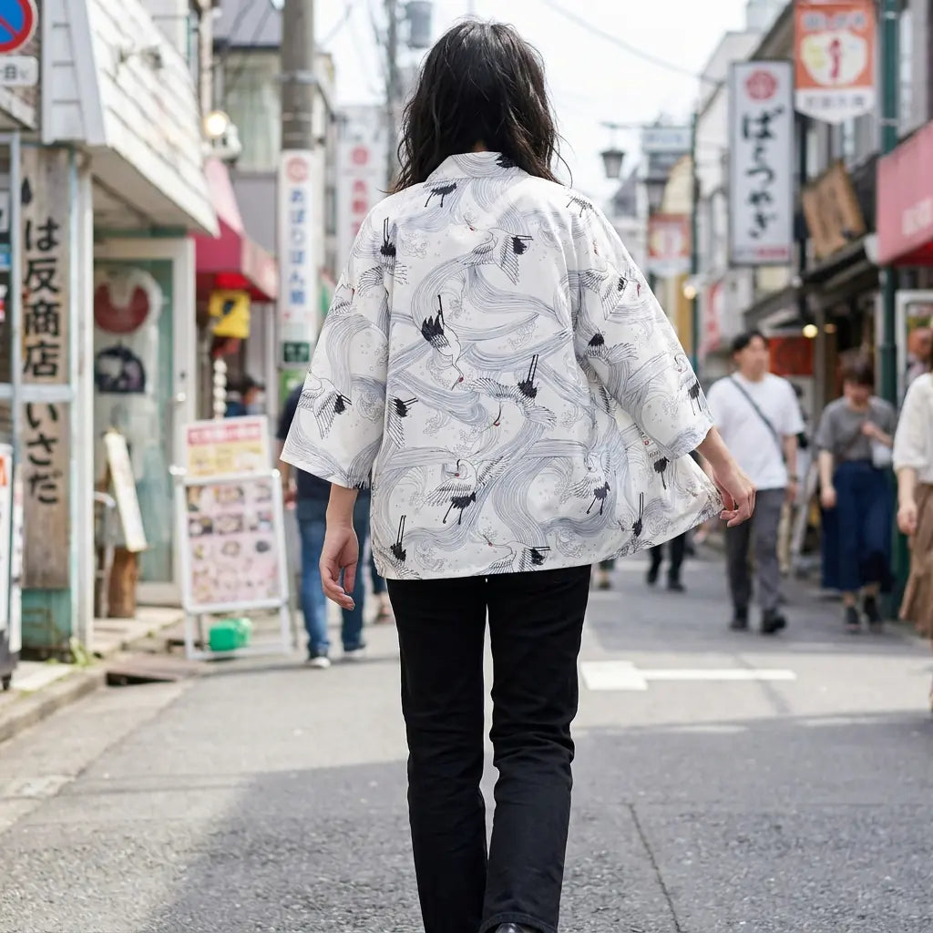 Woman seen from behind wearing a white haori in a Harajuku street