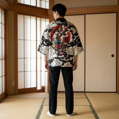 Back view of a black haori jacket in a washitsu room, showing the full back design