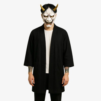 Black haori jacket for men with a minimalist, flowing silhouette, ideal for a refined and understated Japanese look. The man wears a white hannya mask