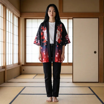A haori jacket women wear open, black with a red floral print, photographed on tatami.