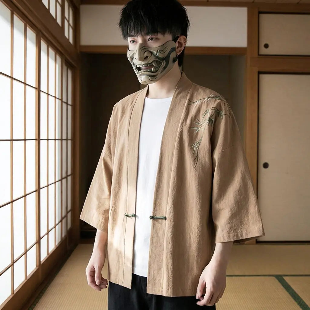 Man wearing a haori kimono jacket in a Japanese washitsu room with shoji screens, waist-up front view