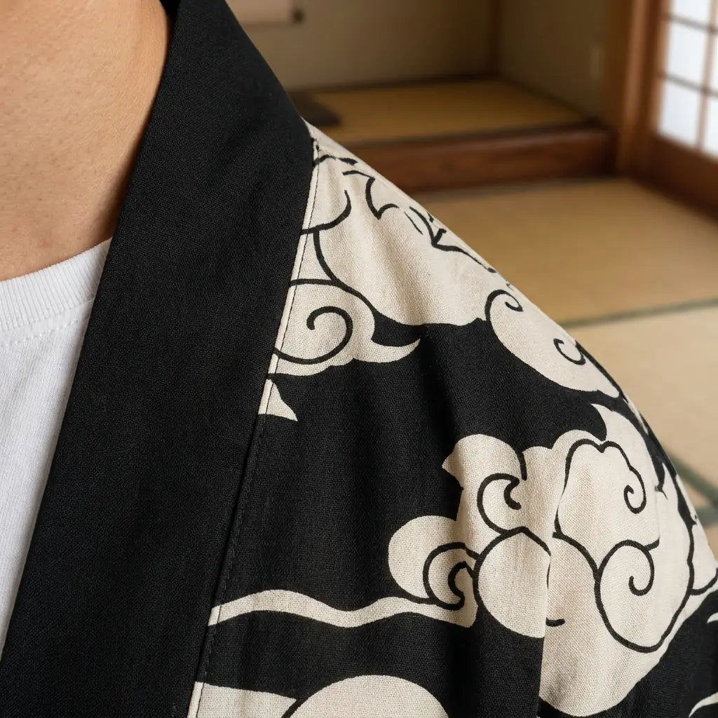 Close-up of the printed fabric and sleeve of a black haori jacket