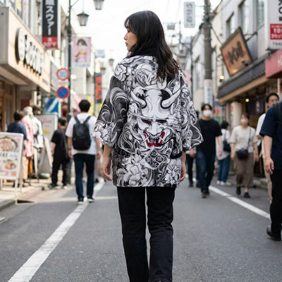 Woman seen from behind wearing a kimono haori in a Harajuku street