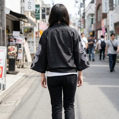 Woman seen from behind wearing a dragon haori in a Harajuku street