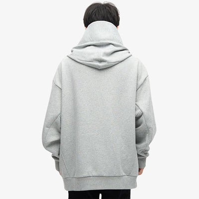 a japanese is dressed with Harajuku fashion hoodies men designed with minimalist grey color, durable fabric, perfect for a trendy and fashionable Japanese streetwear style