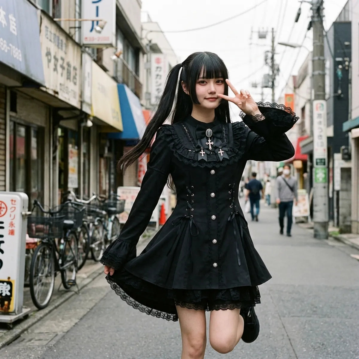 Harajuku gothic street look, the flared lace cuffs and the ruffled hem caught in movement