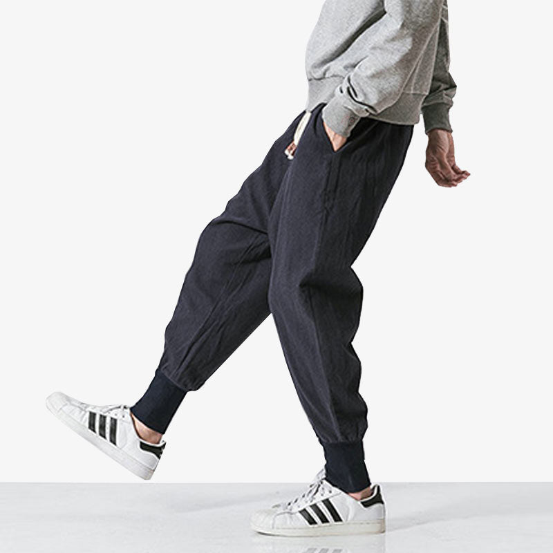 A man is dressed with Japanese harajuku pants menswith white sneakers