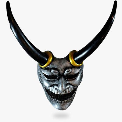 Japan Oni masks are a samurai accessory. Japanese mask with horns and fangs like an Oni from the underworld