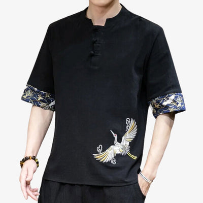 A man is dressed with Japanese bird shirt mad of embroidery