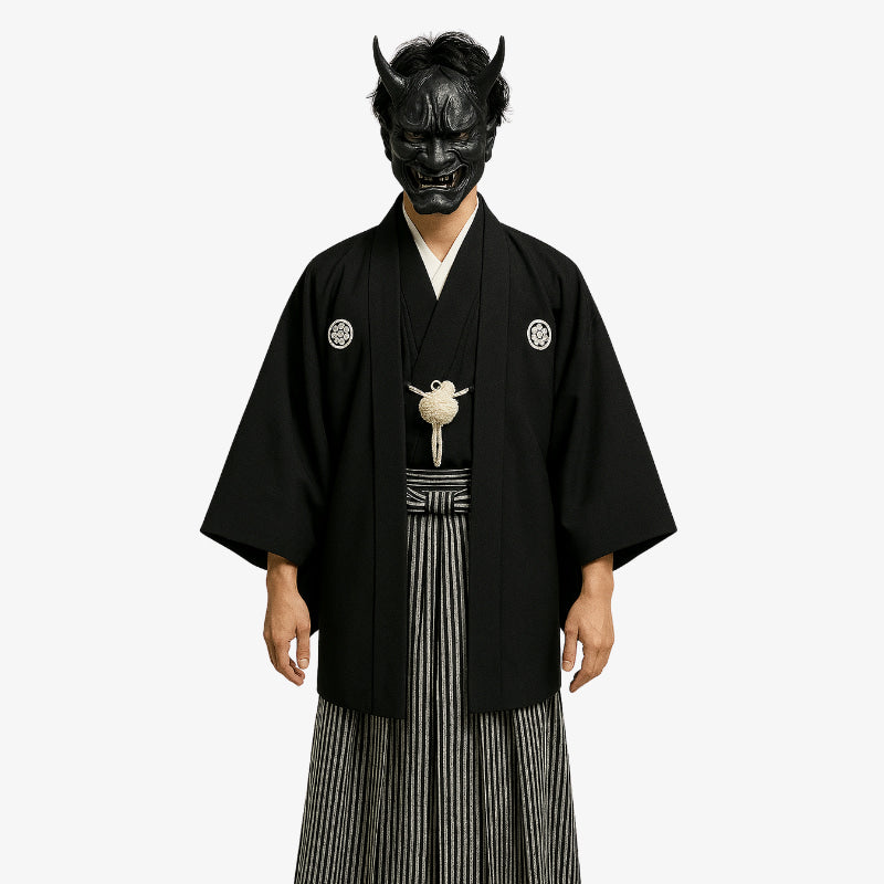 Japanese black kimono made with Habutae silk and adorned with family crests, complemented by a haori jacket and traditional striped hakama trousers.