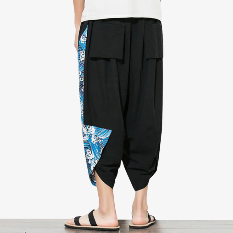 this black japanese cropped pant is a Japanese blue wave pants featuring iconic blue wave motifs, merging tradition with contemporary design.