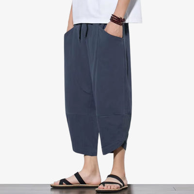 Japanese cropped pants mens style featuring wide legs and a relaxed fit, combining traditional Japanese silhouettes with contemporary streetwear trends.