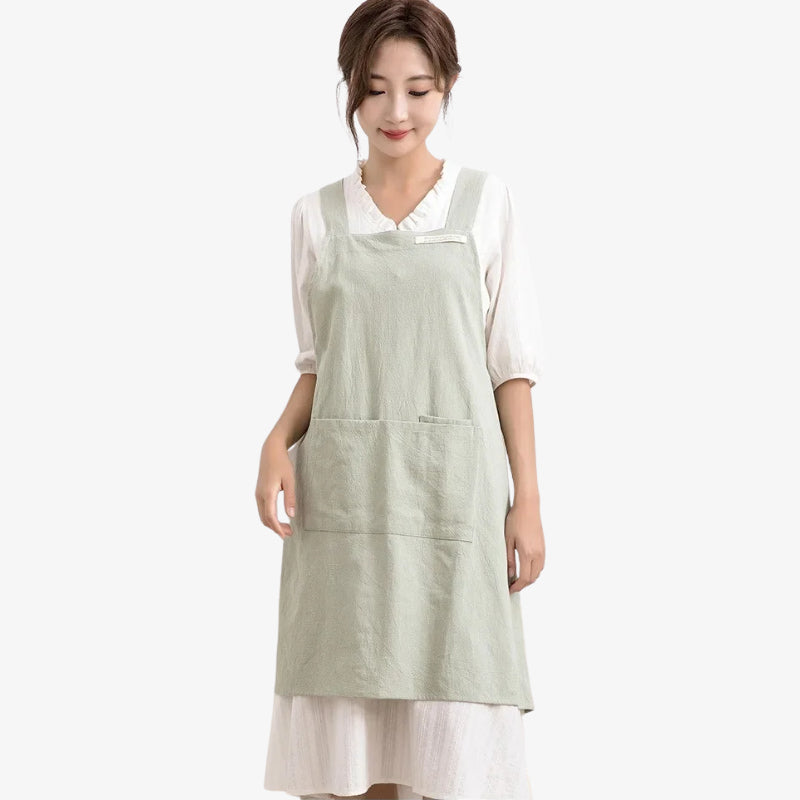 Japanese cross back apron made from breathable linen and cotton blend, designed for comfort and durability with practical rear straps for a secure fit.