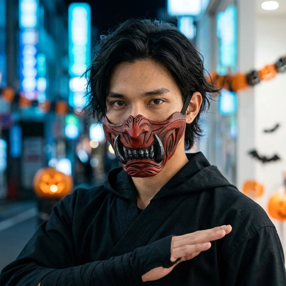 Japanese demon mask: red oni half mask worn at night for Halloween, blue Tokyo neon behind