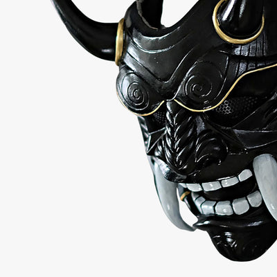 This Black Japanese demon Oni mask is a handcrafted piece, featuring detailed hand-painted and sculpted designs with horns and sharp teeth that embody Japanese folklore.
