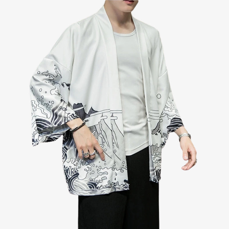 Person wearing a white japanese dragon kimono style jacket with black and gray abstract patterns on sleeves and front.