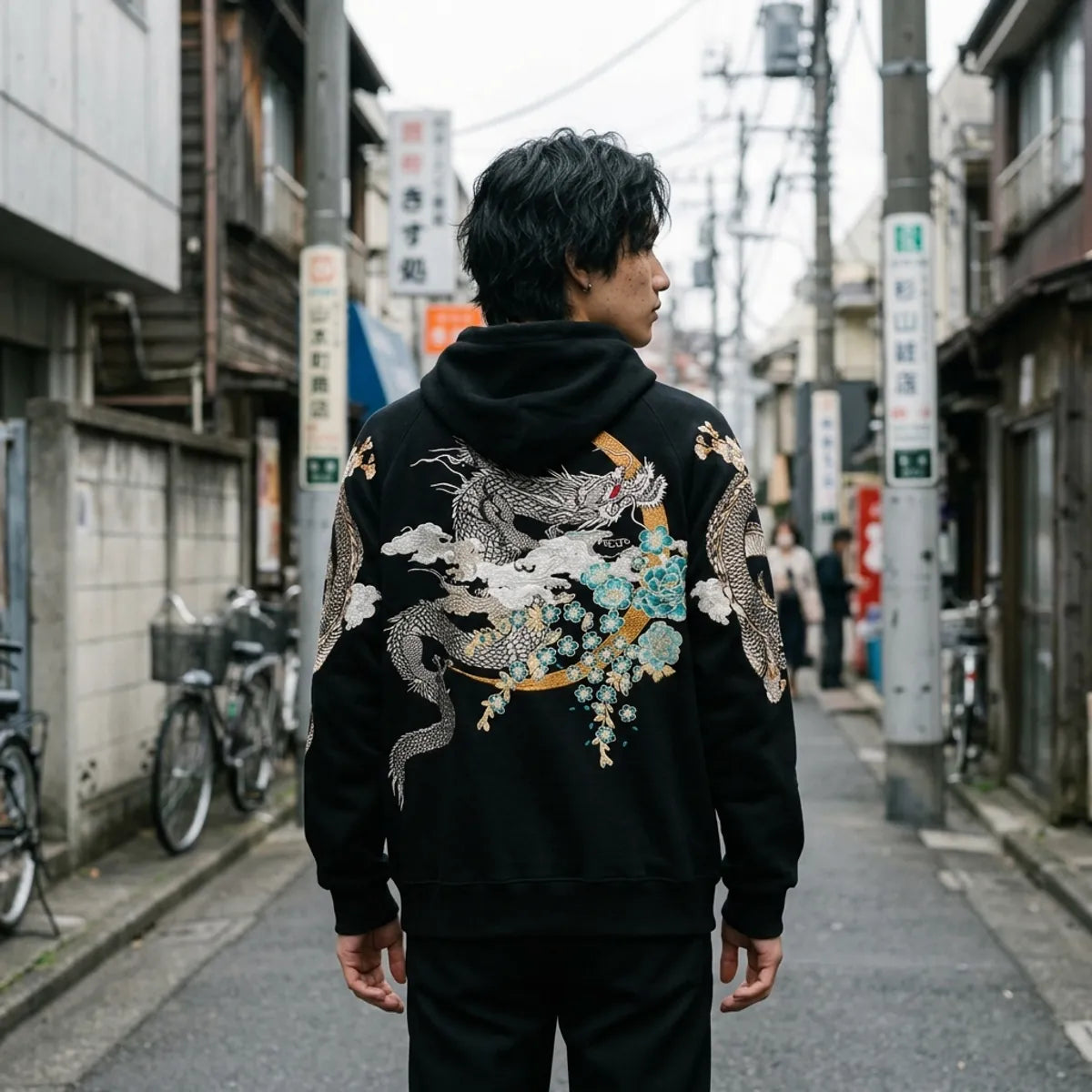 The back of the Japanese dragon sweatshirt: a silver dragon coiled around a gold ring with turquoise flowers