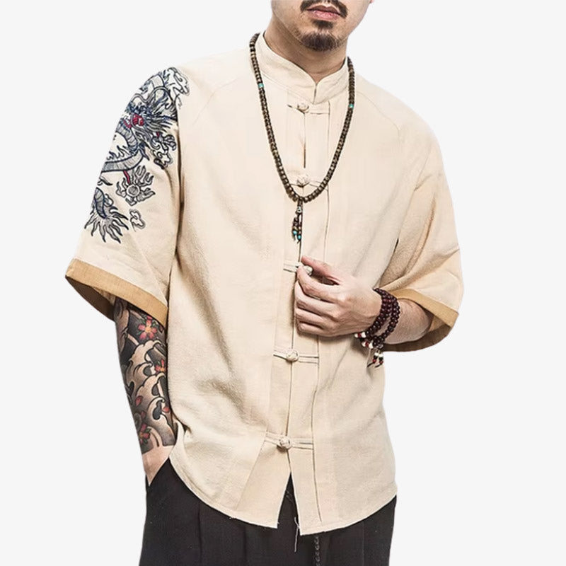 A man is dressed with a Japanese dragon t-shirt featuring a powerful dragon motif embroidered inspired by traditional Japanese mythology, ideal for bold streetwear looks.