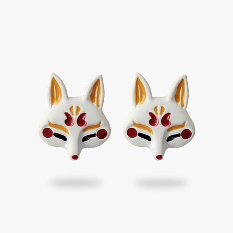 These Japanese earrings are in the shape of a Kitsune fox mask.