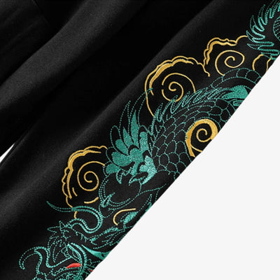 japanese Embroidered fabric with green and gold dragon design on black background