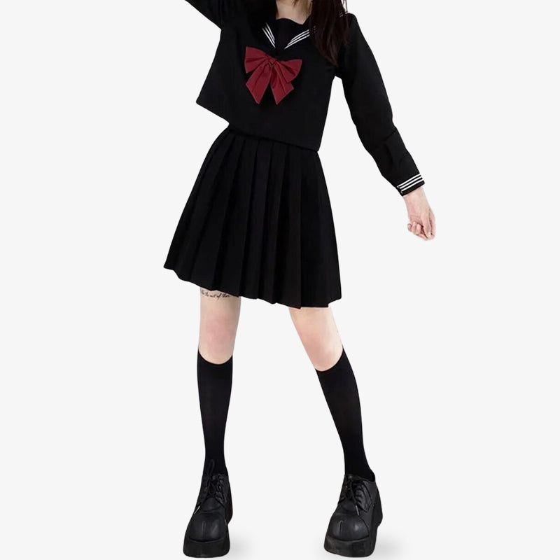 For a cosplay costume wear a japanese girl high school sailor uniform. The woman is dressed with a black shirt, japanese long socks and black shirt