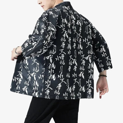 Black jacket with white text pattern worn by a person on a white background