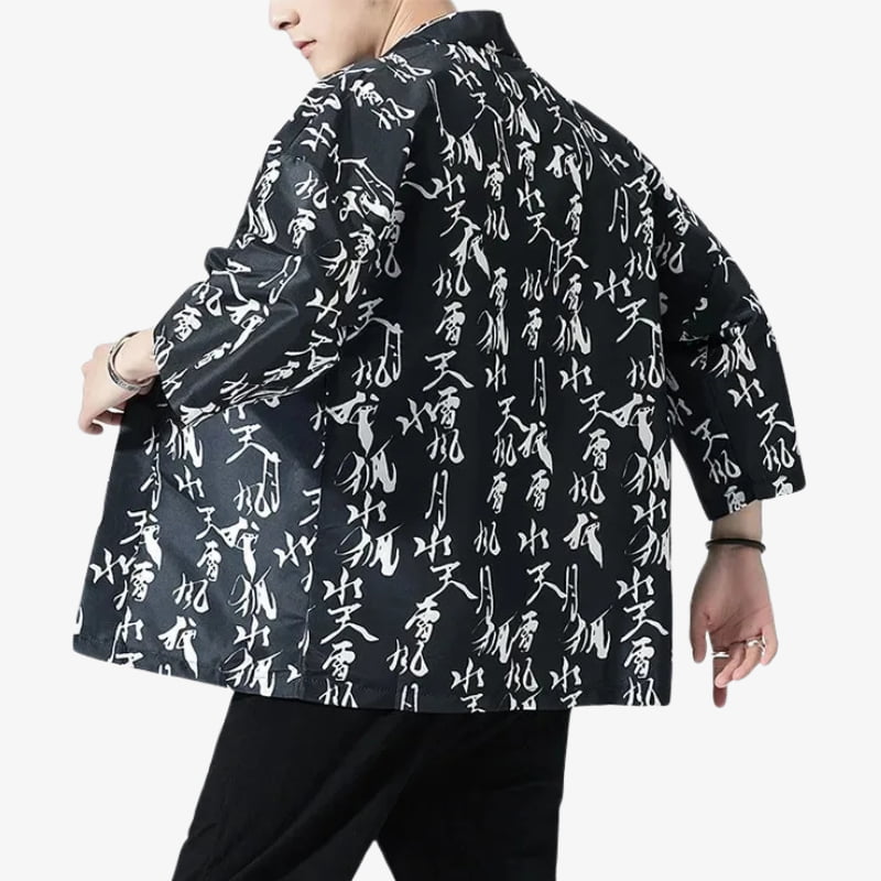 Black jacket with white text pattern worn by a person on a white background