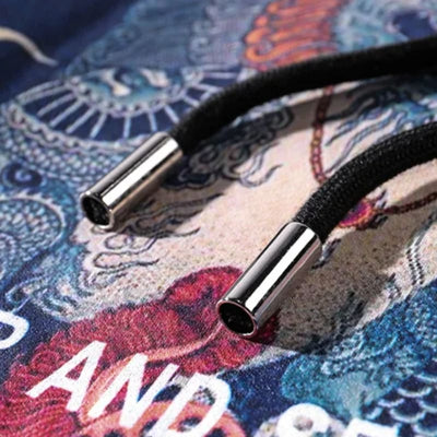 Close-up of a Japanese hoodie drawstring on a colorful fabric background