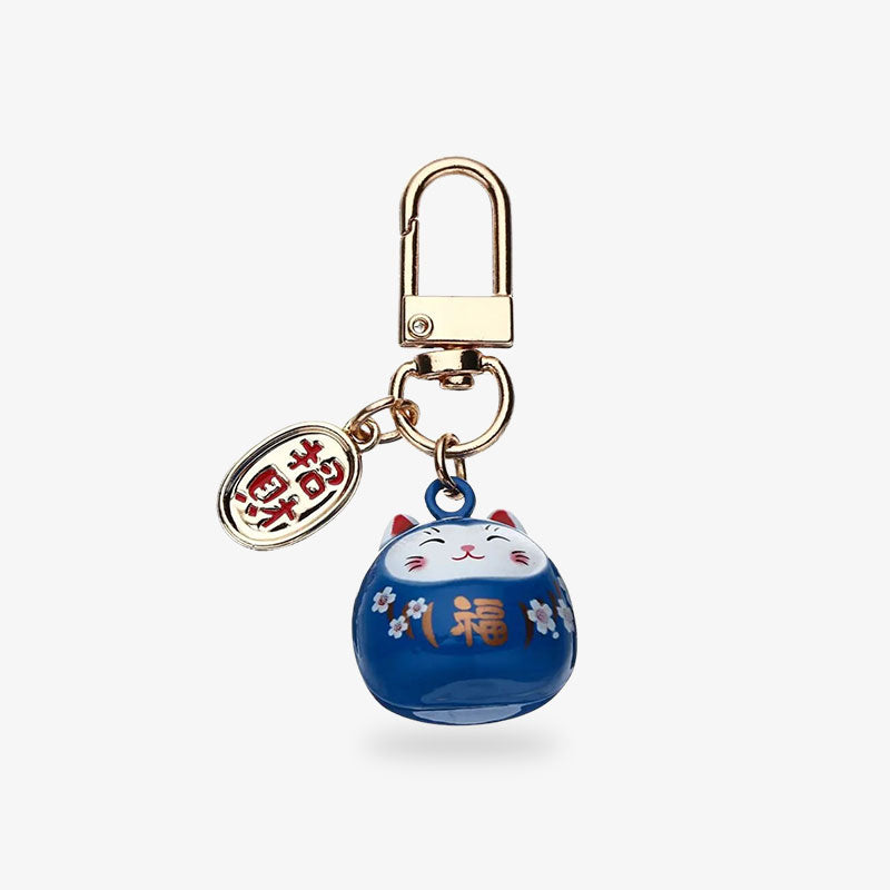 This japanese keychain cat is midnight blue with a piece engraved with a Japanese kanji. Color is purple with ceramic material and japanese symboles painting