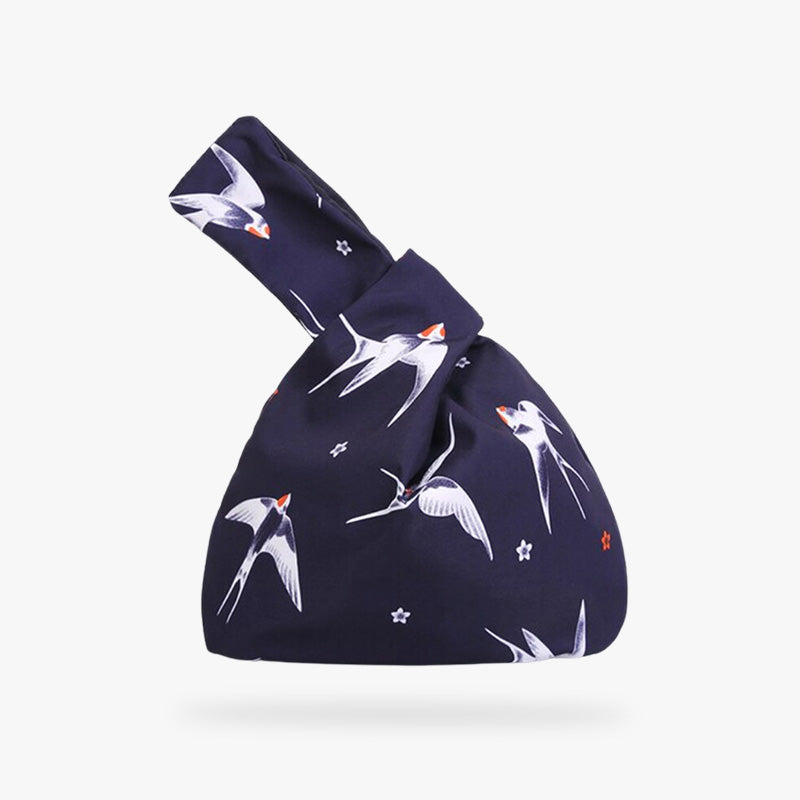 Carry a piece of tradition with the Japanese Kimono Bag, beautifully crafted to mirror the artistry of Japanese kimonos.This Japanese women's bag is a bow bag with a Shidorie bird motif. It's a Japanese symbol that signifies freedom. This traditional bag is practical and functional