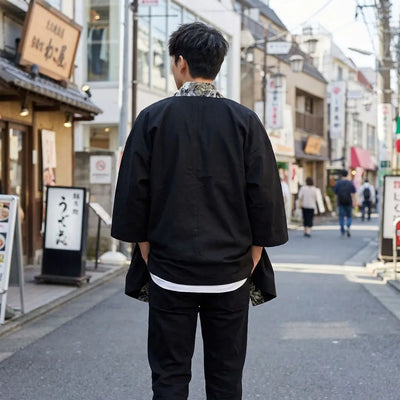 Back view of a japanese kimono haori worn in a Harajuku street, showing the full print