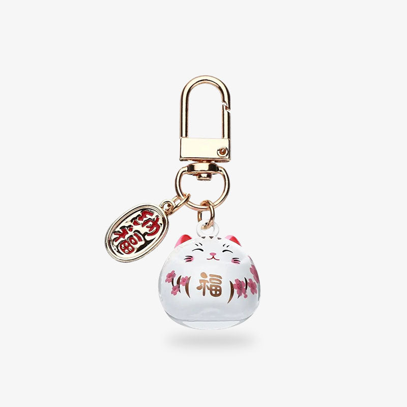 To attract luck and wealth, here's the japanese lucky cat keychain. This Japanese object in the shape of a kawaii cat is white with a gold-coloured piece engraved with a Japanese kanji.