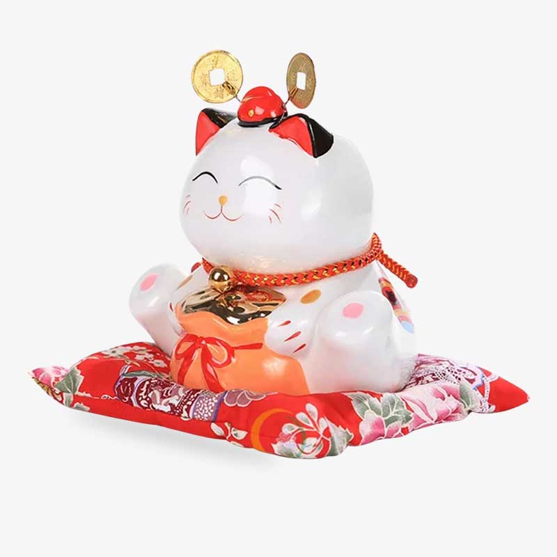 This japanese lucky cat maneki neko statue is in white ceramic. The lucky cat is sitting on its paws and holding a bag filled with kobon coins. The Maneki neko cat attracts luck, good fortune and prosperity.