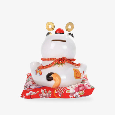 This japanese lucky cat maneki box is made of ceramic. There is a slot in its head to hold coins.