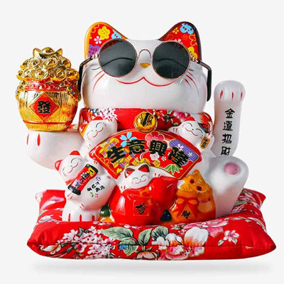 This lucky cat is a Japanese maneki neko. It is the lucky cat that raises its left paw to attract luck and good fortune.