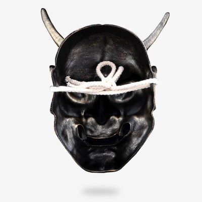 No mask from Japan in the shape of a demon's face. Japanese oni mask hannya with rope to attach it to the head