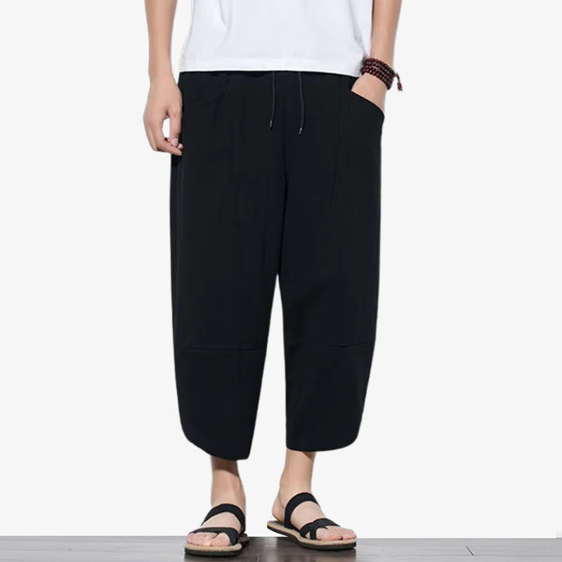 a black colored Japanese pants casual style featuring relaxed fits and clean lines for versatile everyday wear.