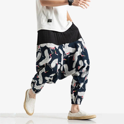 These japanese pants men is large. Japanese style pants are a wide, flowing traditional garment. Tsuru Japanese cranes are printed on the fabric.