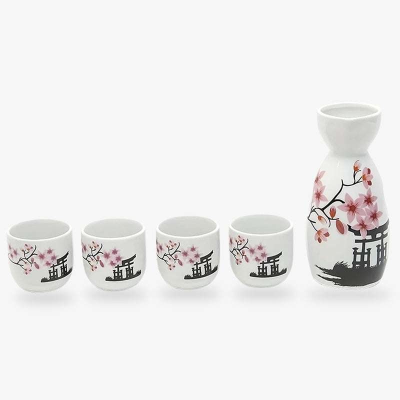 Japanese sake drink set, including four cups and a one serving bottle with classic Japanese designs. The white ceramic sake glasses and sake bottle are painted with Torii door and sakura flowers