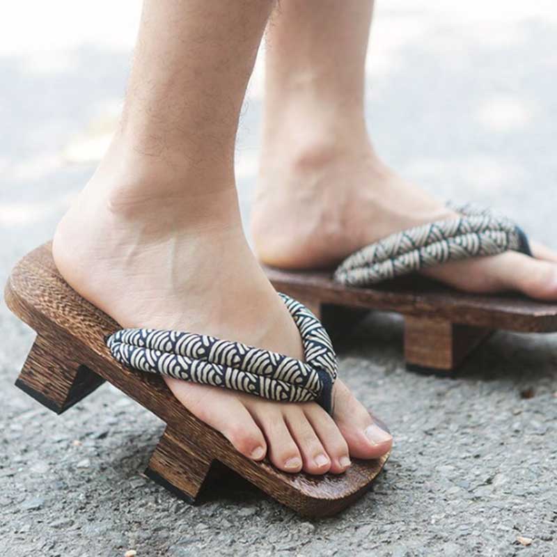 Authentic Japanese samurai geta sandals, featuring a rugged design with elevated wooden soles for historic martial attire