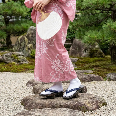 Japanese Shoes Woman worn with a pink kimono in a Japanese garden