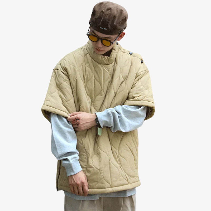 a man is dressed in a khaki-colored Japanese streetwear hoodie. He's also wearing a pair of glasses on his face. He has a harajuku style