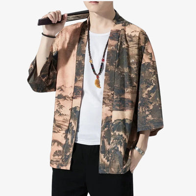 Person wearing a patterned Japanese streetwear kimono style jacket over a white shirt on a white background