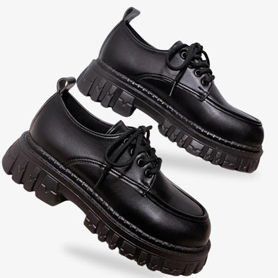 Japanese student shoes, a staple of school unirform in Japan, combining style and functionality. Black japanese shoes with a high platform ant leather material