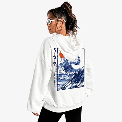 a Girl is dressed with a white Japanese-style hoodies. The japanese sweatshirt is printed with the great wave of kanagawa design. The withe japanese sweater is made with cotton material